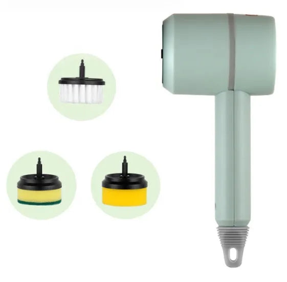 Green electric cleaning brush with scouring pad and brush heads on a kitchen worktop.