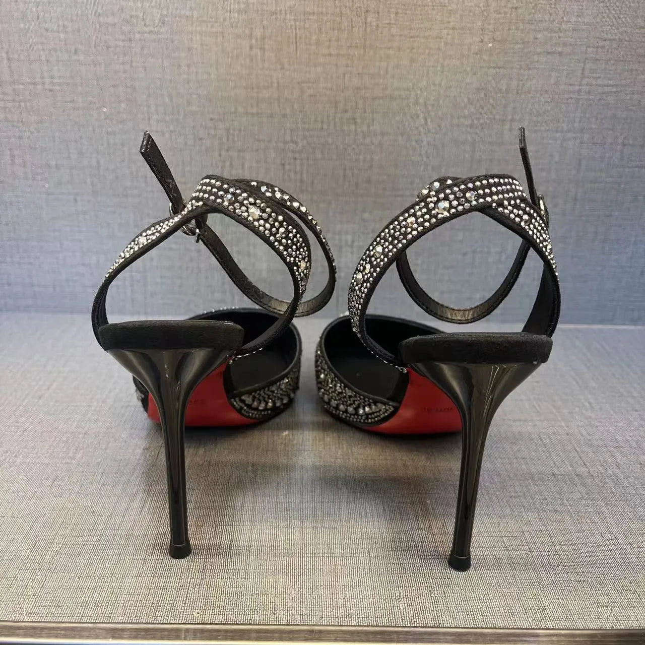 Women's hollow high heels with red sole, stiletto heel, and pointed toe in silver or black colours
