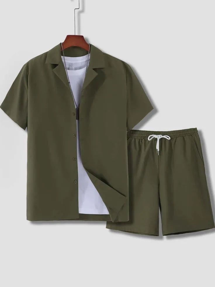 Man wearing a white short sleeve Cuban collar shirt and matching shorts from a polyester sport suit set.