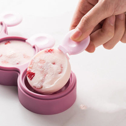 Food grade silicone doughnut ice cream mold in yellow, green, and purple