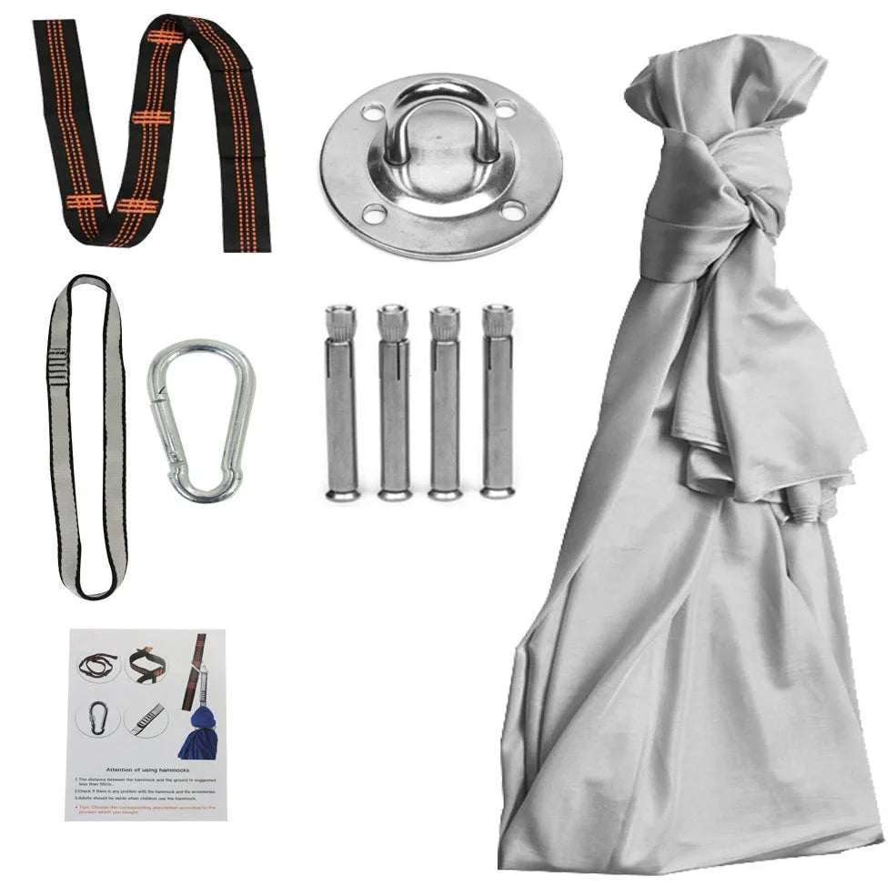 Child in black therapy swing cocoon with multi-loop daisy chain height adjustment system