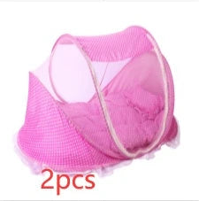 Portable foldable baby bed net with built-in mattress and pillows, perfect for travel and outdoor activities