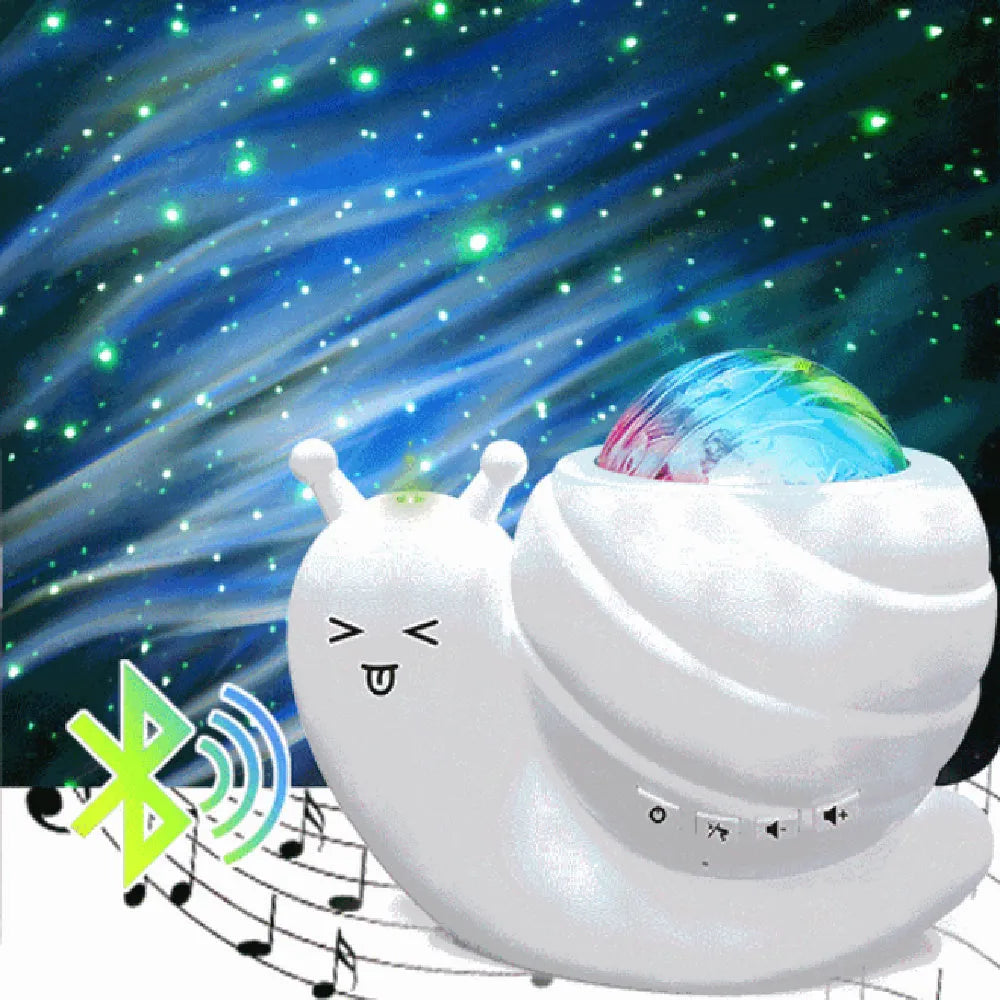 Snail-shaped blue starry sky projection lamp with USB cable and remote control on a table