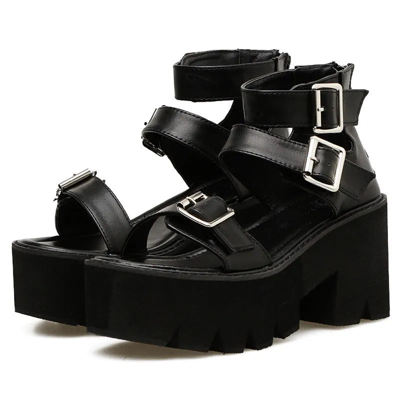 Black women's punk platform sandals with chunky heel, round toe, buckle detail, and back zipper.