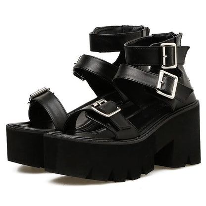 Black women's punk platform sandals with chunky heel, round toe, buckle detail, and back zipper.