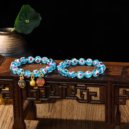 Handmade glass bracelet with 10mm swallowing gold beast cherry blossom heart charm in six colour options
