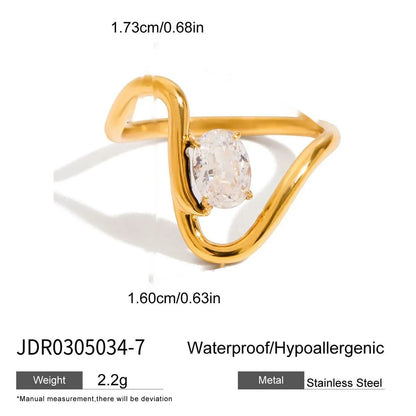 Geometric titanium steel zircon ring in stainless steel on a grey background.