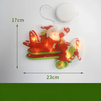 LED Christmas hanging lights with suction cups showing snowman design illuminated on window