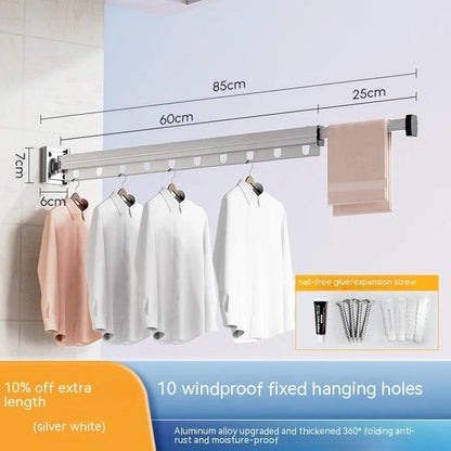 Aluminum retractable drying rack mounted on a window, extending outward for clothes drying