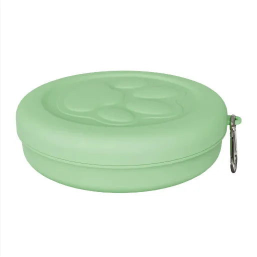 Collapsible silicone dog bowl with integrated snack compartment in light pink colour