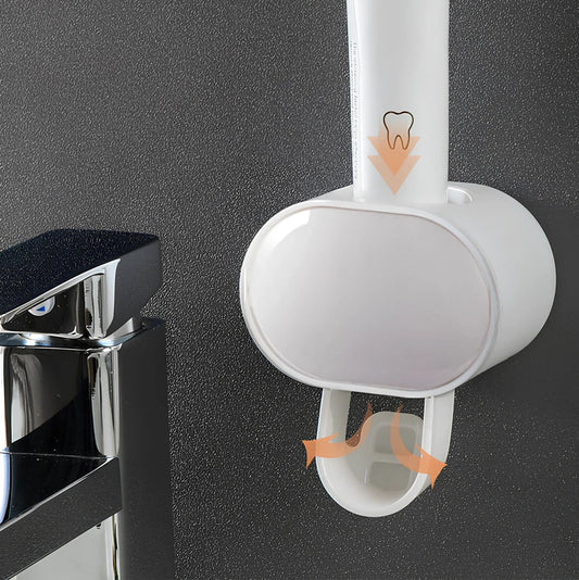 Black wall mounted automatic toothpaste dispenser with squeeze mechanism and dustproof toothbrush storage