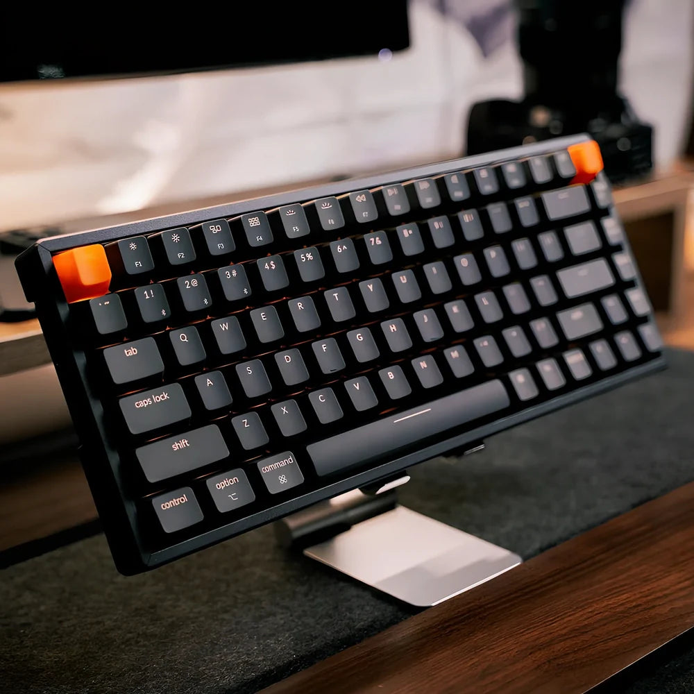 Grey 87-key mechanical keyboard with white backlight showing USB, Bluetooth and Type-C connectivity ports