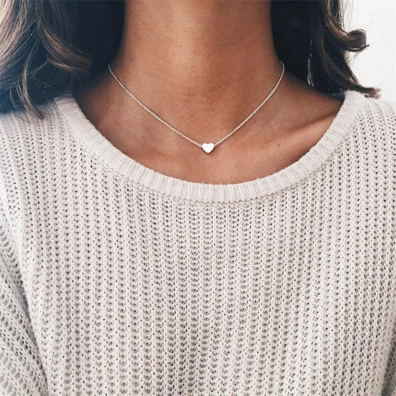 Elegant clavicle necklace with a double-sided love pendant, made of high-quality alloy for a timeless, fashion-forward look.
