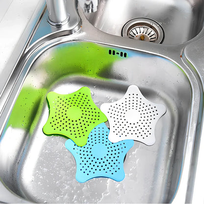 Three starfish-shaped sink drain filters in white, blue and green colours showing suction cups on bottom