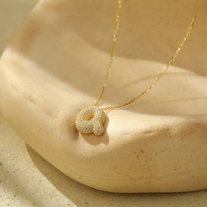 Stainless steel initial pendant necklace with zircon accents, personalized with your choice of letter.