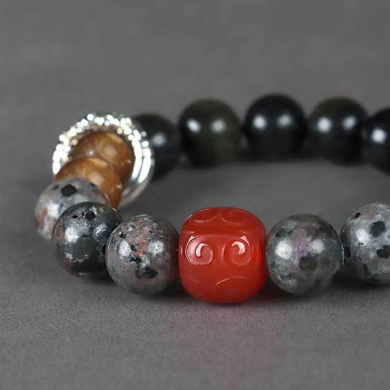 Gold obsidian, flame stone and red agate beads on unisex bracelet with manual processing