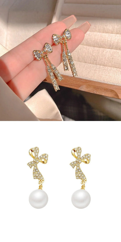 Gold bow-shaped earrings with crystal embellishments, lightweight and elegant