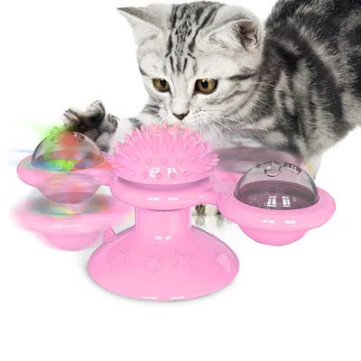 Cat rotating windmill toy with suction base, two transparent bins, blue and yellow-green TPR body.