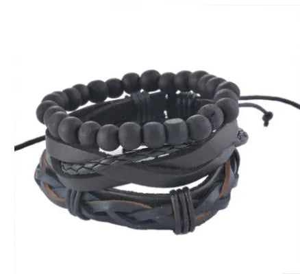 Hand-woven brown leather bracelet with wooden beads and rope detailing on a wrist.