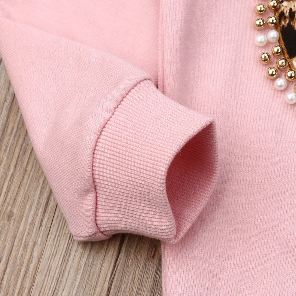 Pink cotton print sweatshirt and matching pants two-piece set with Asian sizing chart showing measurements