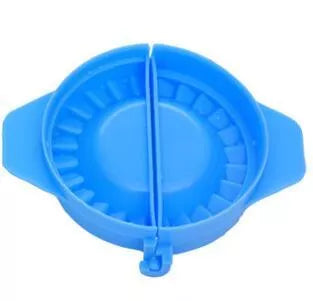 Plastic dumpling maker device in blue, green, and white for quick, uniform dumplings