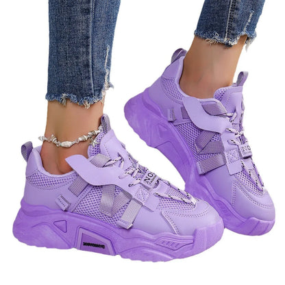 Women's platform sneakers in animal print with breathable mesh upper and front lace-up design.