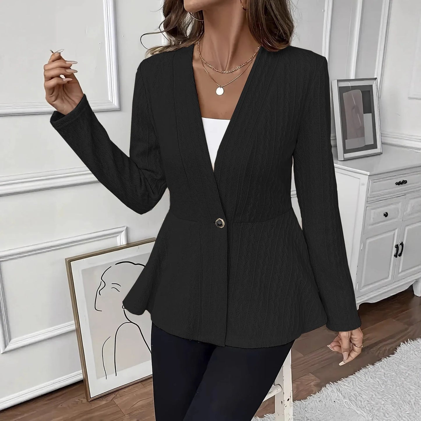 Women's apricot coloured knitted cardigan with jacquard pattern and one button front closure.