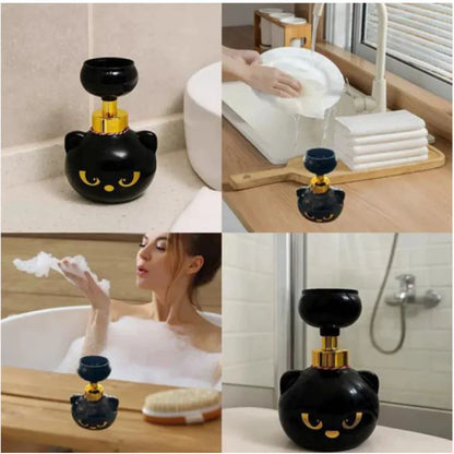 Black plastic cartoon cat-shaped manual soap dispenser on a countertop.
