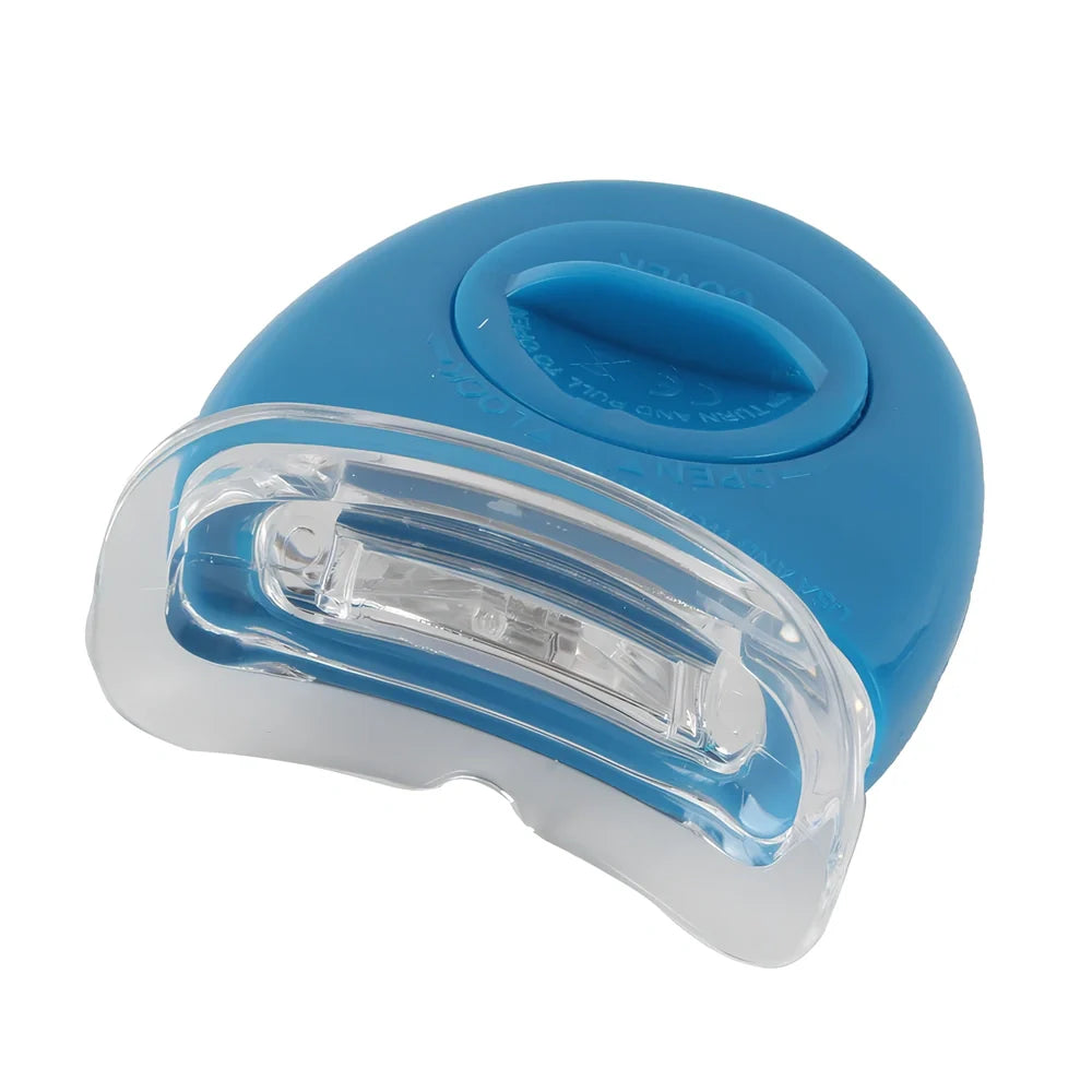 Teeth whitening gel kit with thermoform trays, cold light lamp, 10 gel syringes, and 3D shade guide showing 7-10 improvement