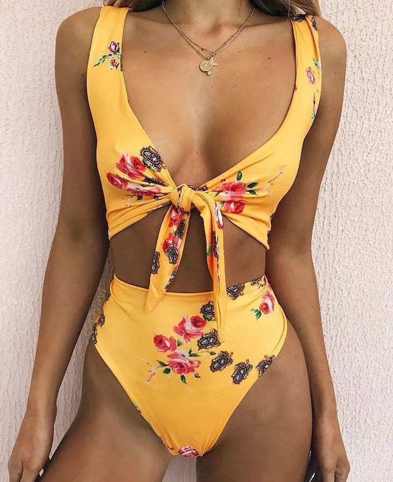 Double-sided knotted bikini swimsuit in yellow, orchid, and white floral patterns