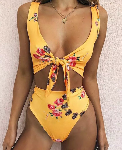 Double-sided knotted bikini swimsuit in yellow, orchid, and white floral patterns