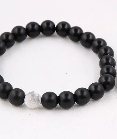 Handcrafted black lava beaded bracelet with seven chakra stones for healing and balance