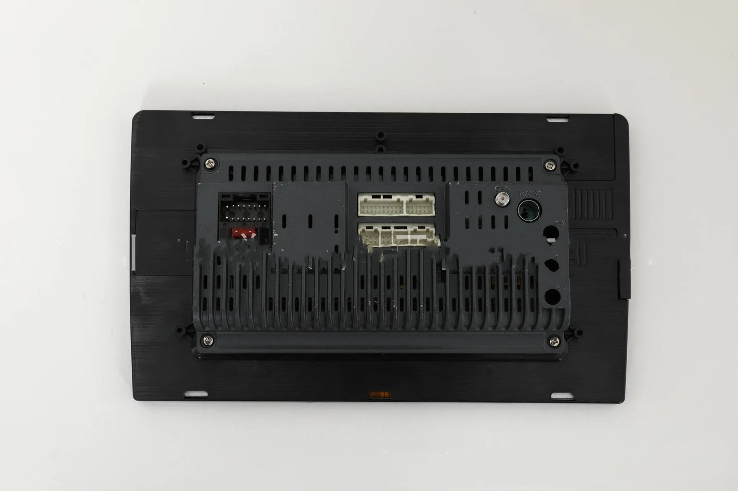 10.1 inch universal Android car stereo head unit with touch screen display for trapezoidal dashboard installation.