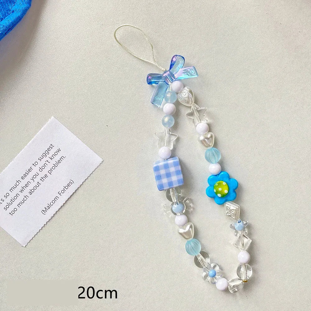 Beaded flower mobile phone lanyard with blue resin flowers on adjustable 120cm cord and secure clasp