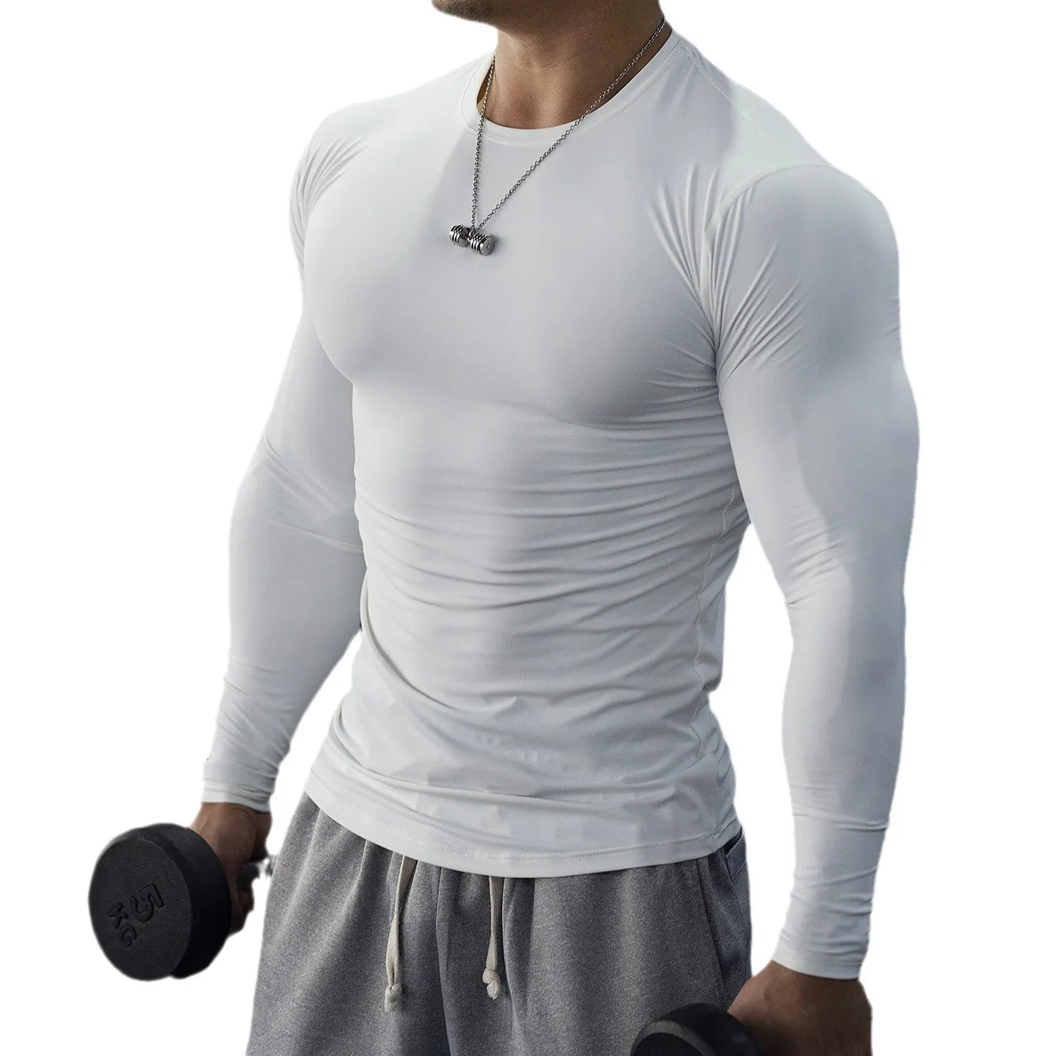 Man wearing black long sleeve slim fit fitness tights for running or gym workout.
