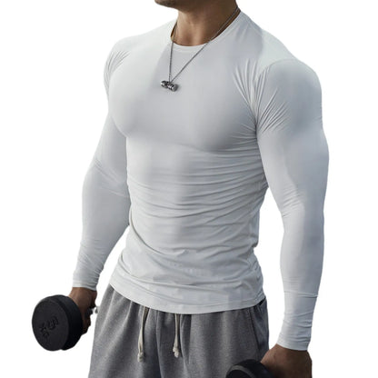 Man wearing black long sleeve slim fit fitness tights for running or gym workout.