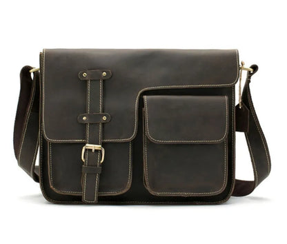 Leather vintage messenger bag in black with adjustable crossbody strap and brass buckle