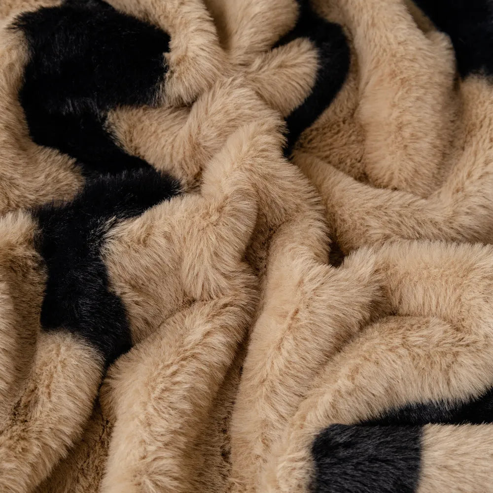 Zebra pattern sofa cover cloth in flannel fabric with non-slip backing, shown in caramel colour on a sofa