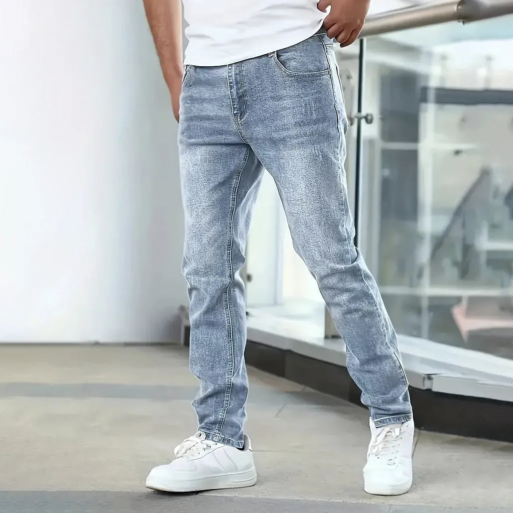 Men's black stretch jeans with straight leg skinny fit showing zipper fly and mid-rise waist