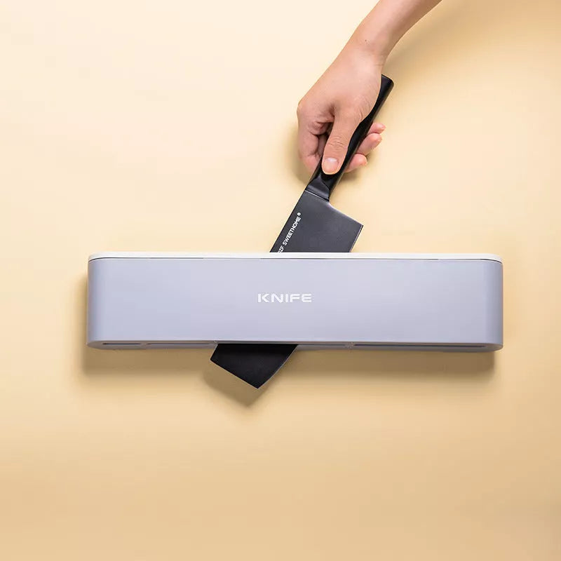 Wall-mounted kitchen knife holder in grey, pink, or light blue, semi-open design for better air circulation
