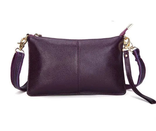 Lady's cowhide slant bag in apricot colour showing front view with strap and compact 24 cm size.
