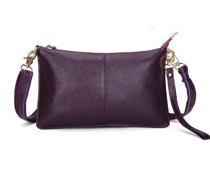 Lady's cowhide slant bag in apricot colour showing front view with strap and compact 24 cm size.