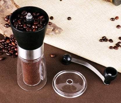 Compact manual coffee grinder with wooden body and stainless steel mechanism for fresh ground coffee at home