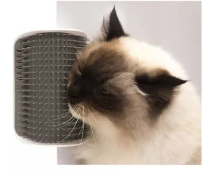 Cat Self-Grooming Brush mounted on wall with cat using it