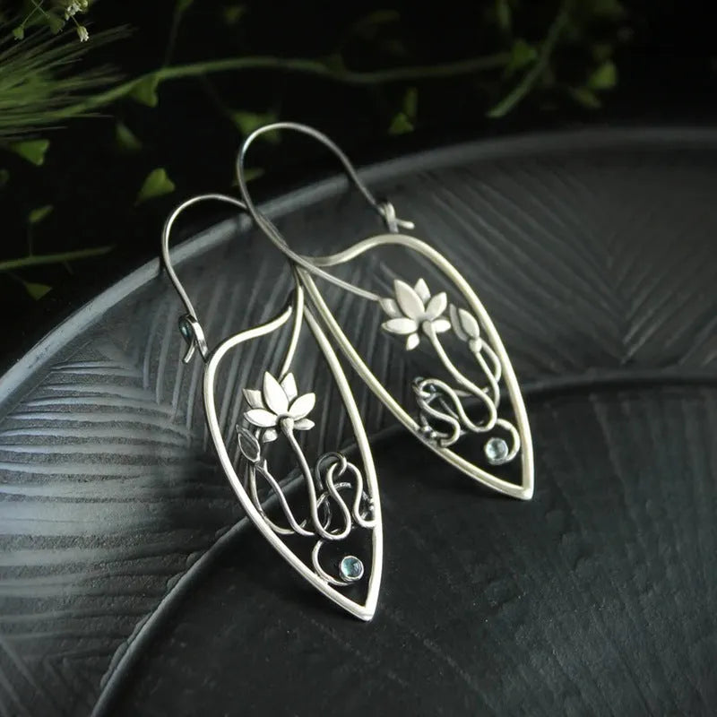 Silver electroplated alloy lotus vine earrings with geometric flower design and round rhinestone details