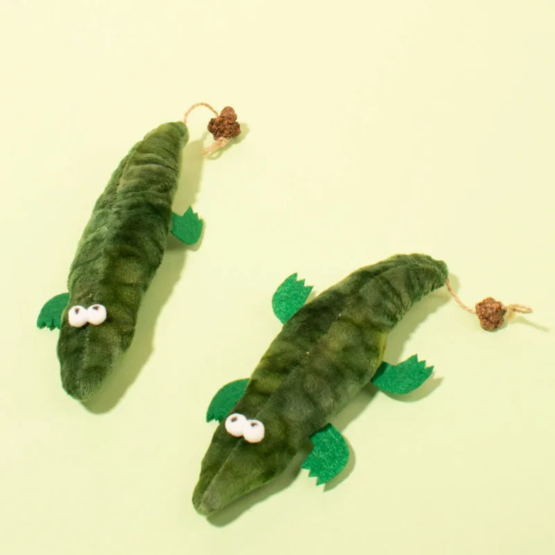 Green alligator plush cat toy with textured surface for dental cleaning filled with catnip and peppermint
