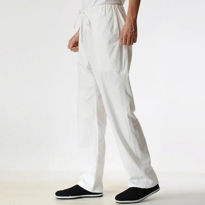 Men's beige pure cotton casual trousers with a drawstring waist on a mid-grey background.