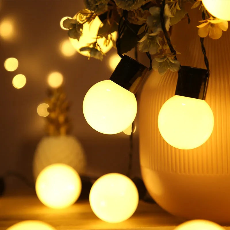 10-metre black wire solar festoon lights with 40 warm white LED bulbs for outdoor decoration