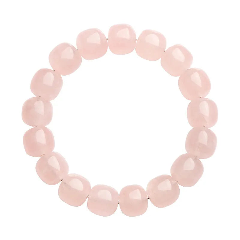 Pink crystal barrel bead bracelet with geometric design measuring 11-12mm beads on wrist
