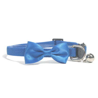 Striped nylon cat collar with decorative bow and bell in multiple colour options on a white background.